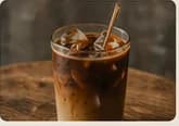 signature iced coffee served over ice in a clear glass
